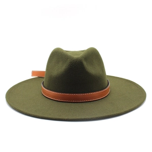 Detail of army green felt fedora with brown leather band and white contrast stitching