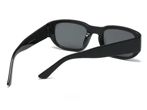 Detail view of square black sunglasses showing model 5487 and size parameters on temple
