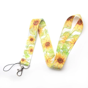 Close-up of fabric lanyard with yellow sunflower pattern and silver swivel lobster clasp