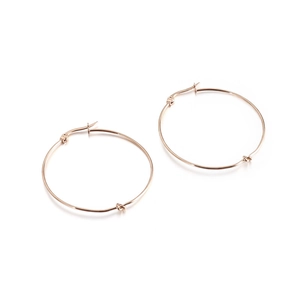 Minimalist rose gold stainless steel hoop earrings with a decorative knot detail