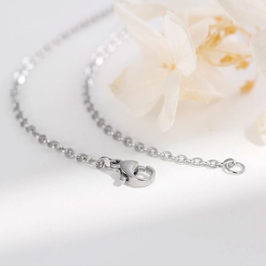 Minimalist silver zircon jewelry set featuring steel chain and lobster clasp closure