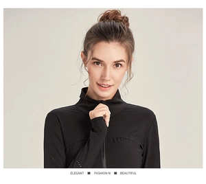 Detail of black slim-fit sports jacket with standing collar and thumb holes for fitness