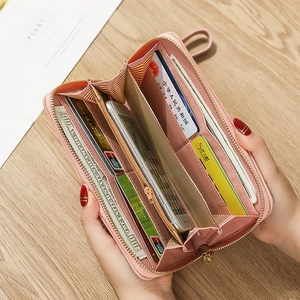 Pink faux leather long zip-around wallet with high capacity card slots and phone pocket