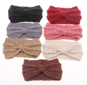 Flat lay of 7-pack bohemian knit headbands with bow design in various winter colors