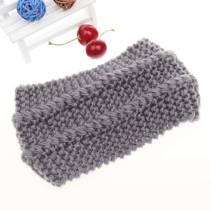 Close-up of grey chunky knit ear-warmer headband with textured wave crochet pattern