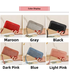 Close-up of multi-colored long wallets with crocodile stone texture and wrist straps