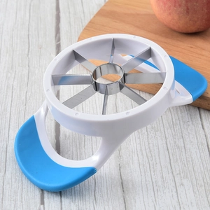 Stainless steel apple slicer with ergonomic blue handles on light wood background
