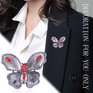 Elegant vintage silver butterfly brooch with red crystals and rhinestones for women