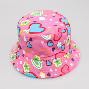 Detailed view of kids pink sun hat with colorful heart and flower pattern print