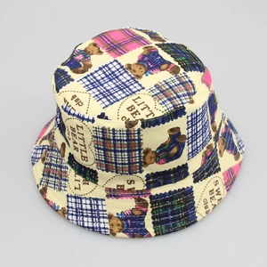 Top view of beige kids sun hat with cartoon bear print and colorful plaid patterns