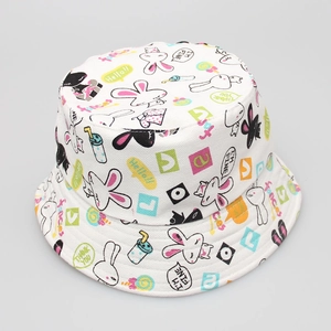 Detail of white cotton bucket hat with colorful cartoon rabbit prints and typography