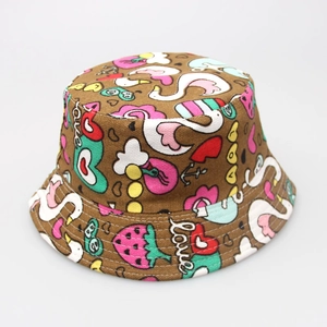 Detail showing high-quality canvas kids bucket hat with colorful swan and heart patterns