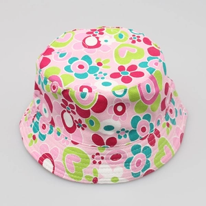 Top view of a pink children fisherman hat with colorful floral and heart patterns