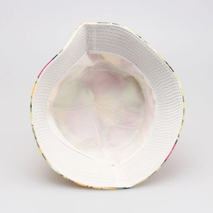 Detail view of floral kids sun hat showing white inner lining and fine quilting craftsmanship