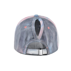 Detail view of tie-dye ponytail sun hat with adjustable metal buckle and back opening