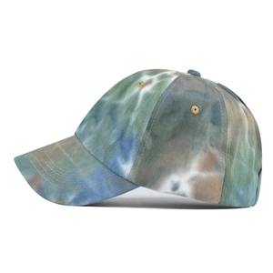 Detail of tie-dye cotton baseball cap featuring olive green and blue vintage pattern