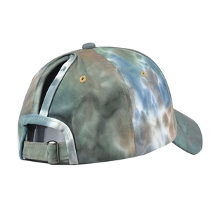 Macro shot of cotton tie-dye baseball cap with ponycap opening and metal buckle
