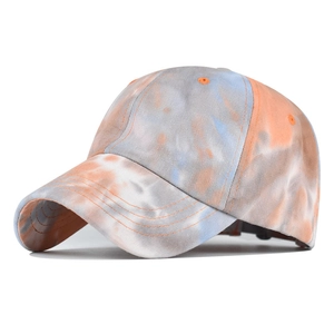 Close-up of the multi-color tie-dye cotton baseball cap with orange and blue hues