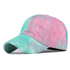 Detailed view of pink and blue tie-dye pattern on cotton baseball cap texture