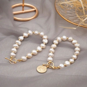 Baroque freshwater pearl bracelet with 18K gold OT buckle and Elizabeth II coin charm