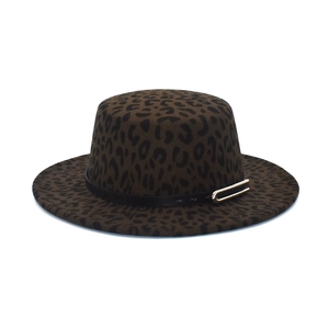 Close-up of leopard print wool fedora featuring a black leather band and gold metal buckle