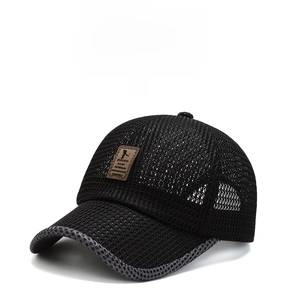 Close-up of black breathable mesh baseball cap with a brown leather EDIKO patch
