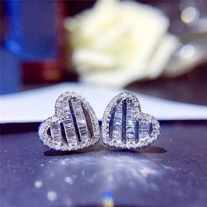 Elegant heart-shaped stud earrings featuring baguette-cut and pavé cubic zirconia