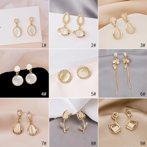 Collage of nine elegant gold earrings featuring opal stones and rhinestones in various styles