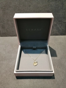 Golden swan pendant necklace with white crystals in a premium pink jewelry gift box