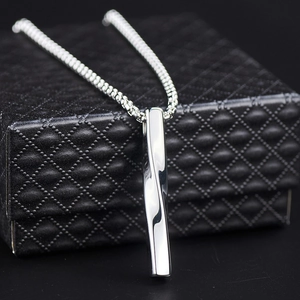 Polished silver twisted bar pendant necklace on black gift box with box chain