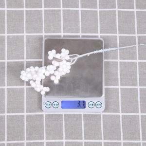 Detailed macro view showing a 3.7g lightweight white foam berry stem for Christmas DIY crafts