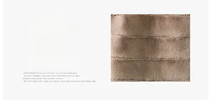 Detail of faux fur vest featuring thick horizontal striped stitching in dark coffee brown