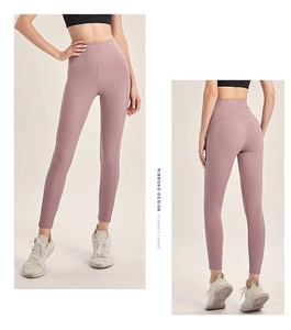 Detail view of high-waist lilac yoga pants with structured seams and firm compression