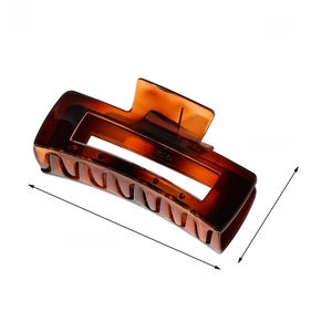 Detail view of a 10cm amber tortoiseshell hair claw clip with specific dimensions shown