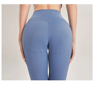 Detail of high-waist yoga pants showing seamless heart-shaped stitching and peach lift effect
