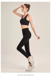 Side view of black high-waisted seamless yoga set showing shaping effect and elasticity
