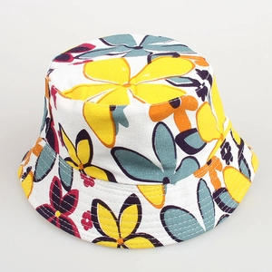Detailed top view of a kids bucket hat with vibrant colorful floral patterns on canvas