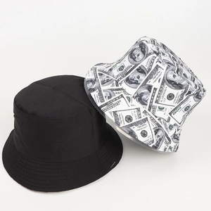 Detail of reversible bucket hat showing solid black side and creative dollar print pattern