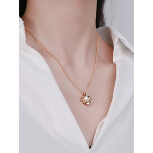 Elegant S925 sterling silver necklace with a heart-shaped gold pendant and white pearl