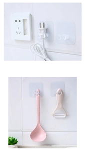 Self-adhesive wall hooks showing appliance plug storage and kitchen utensil hanging detail