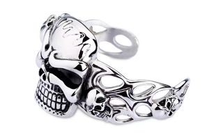 Detailed macro view of vintage skull engravings on silver stainless steel punk ring