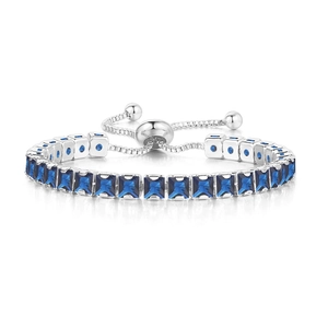 Detailed close-up of blue rectangular cubic zirconia stones on adjustable bolo bracelet