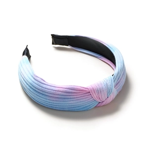 Pink and blue gradient knotted headband made of knitted fabric with a minimalist striped pattern