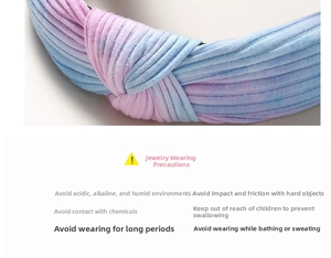 Detail of pink and blue gradient knitted ribbed headband with cross knot texture