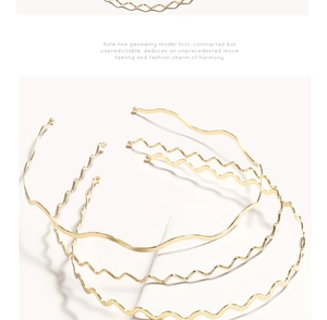 Detail showing various golden wave-shaped metal headbands on a white background