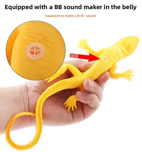 Close-up of internal squeaking device in yellow soft rubber chameleon lizard toy