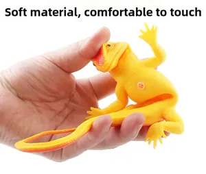 Close-up of soft stretchy orange chameleon toy with realistic lizard scales texture
