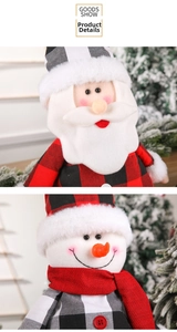 Detailed close-up of plush Santa and Snowman ornaments with red and black plaid patterns