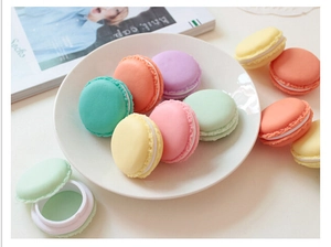 Macro detail of open macaron mini storage box showing interior balm container function