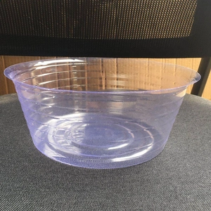 Detail view of a translucent purple plastic basket featuring a circular textured design